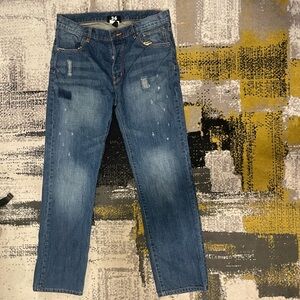 Distressed denim jeans